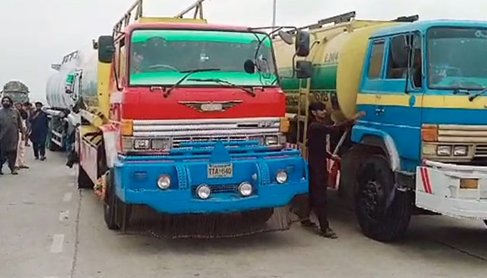 Transporters protest on National Highway over vehicle burnings